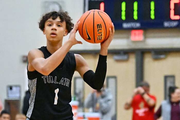 Tualatin sophomore Jemai Lake surveys the floor during a first-round Les Schwab Invitational loss to Beaverton on Dec. 26 at Liberty High School.
